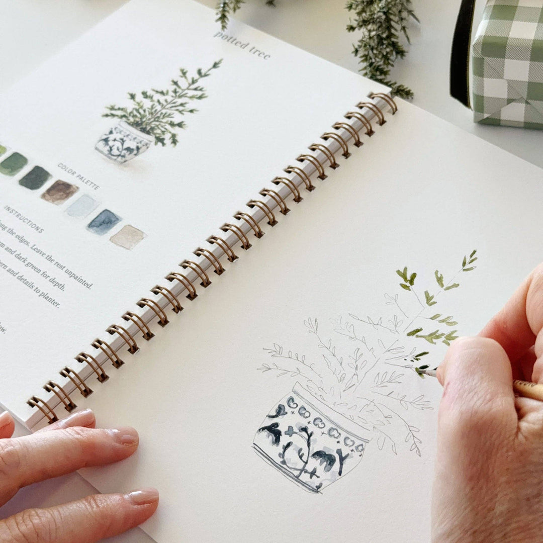Classic christmas watercolor workbook featuring a potted tree illustration. Available in various sizes.