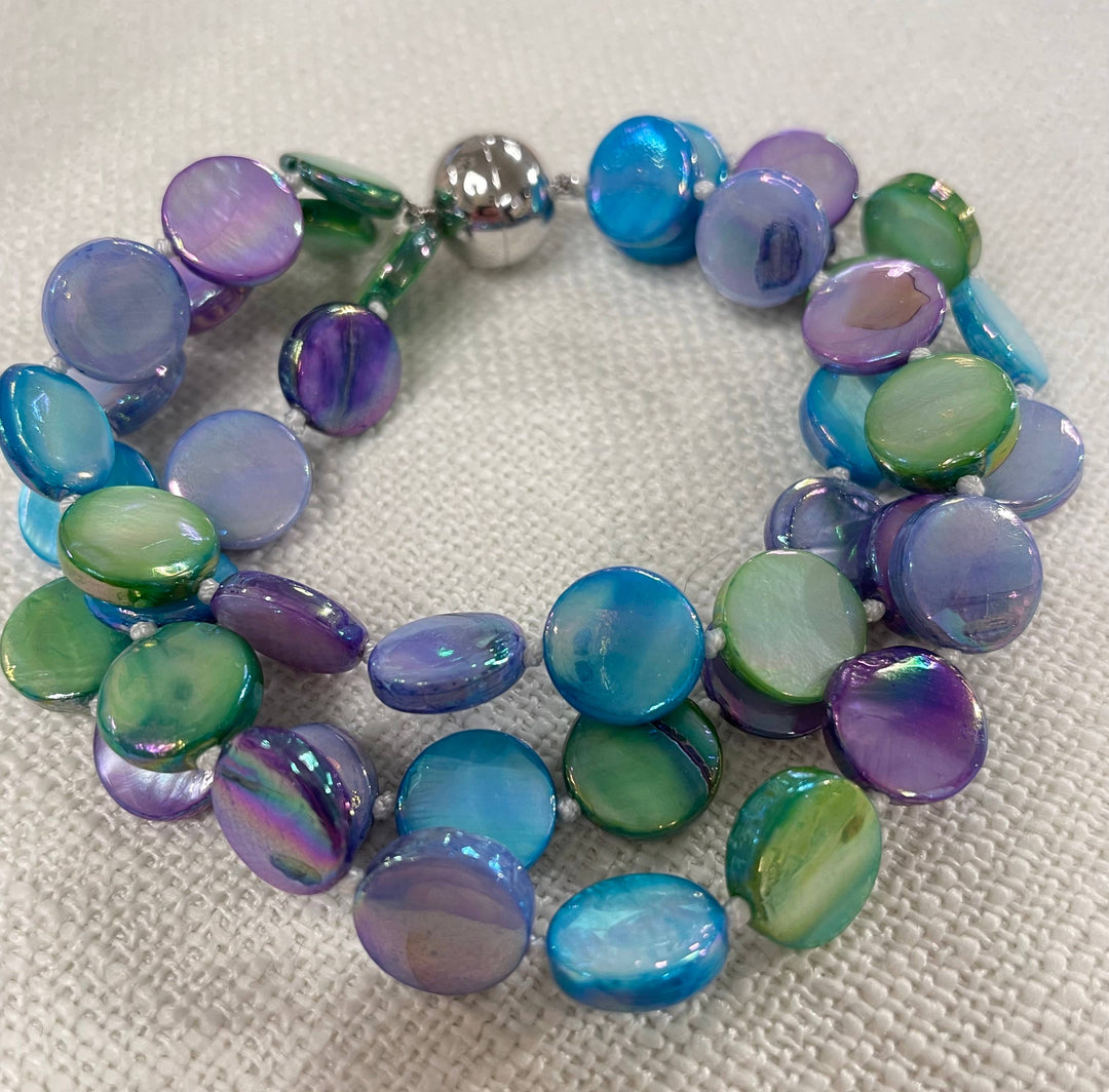 Mother of Pearl Bracelet with iridescent blue, green, and purple beads, two strands, stainless steel magnetic clasp. Sizes: S/M/L.