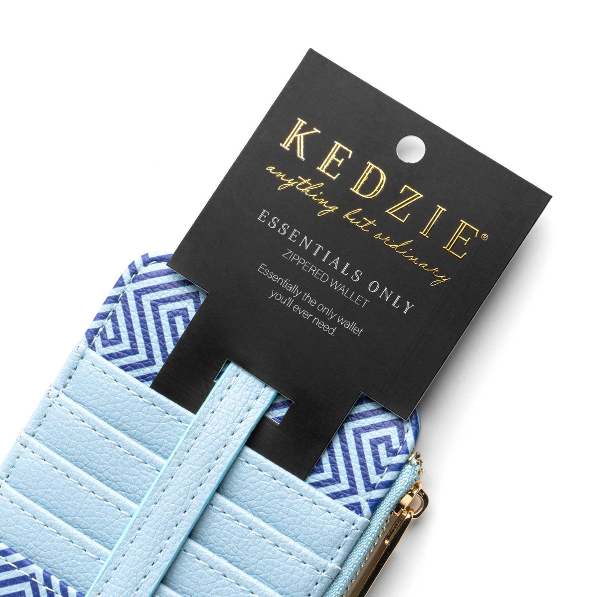 Light blue Kedzie Essentials Only Zippered Wallet – Greek to Me, made of vegan leather with blue and white geometric accents. Features a black tag with product branding, a cheetah print interior lining, and a zippered cash pocket for secure storage. Available in one size.