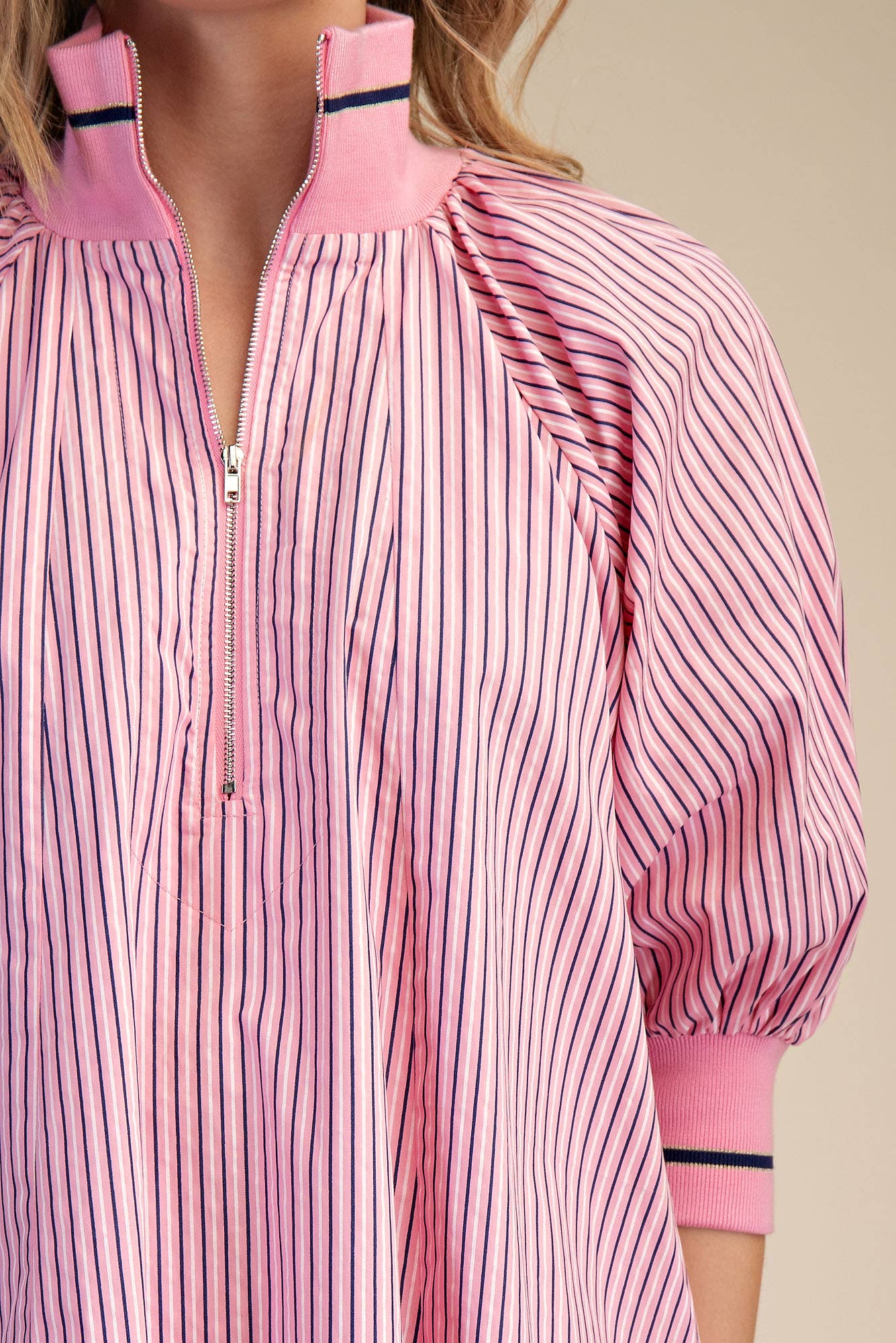 Pink Mock Neck Band Puff Sleeve Dress with thin vertical stripes, zip-up collar, ribbed cuffs. Available in sizes XS-XL.