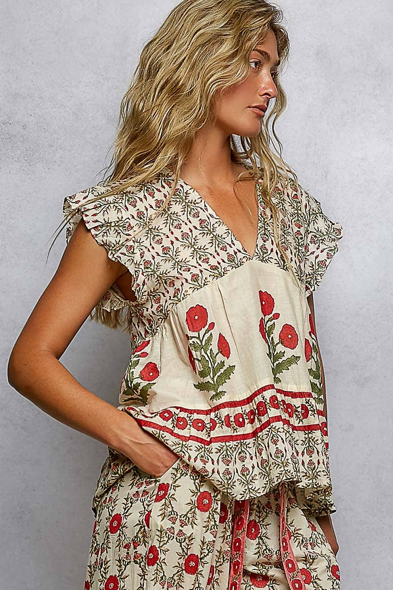 Ruffle Sleeve V-Neck Floral Pattern Top with red and green floral designs, ruffled sleeves. Available in sizes XS-XL.