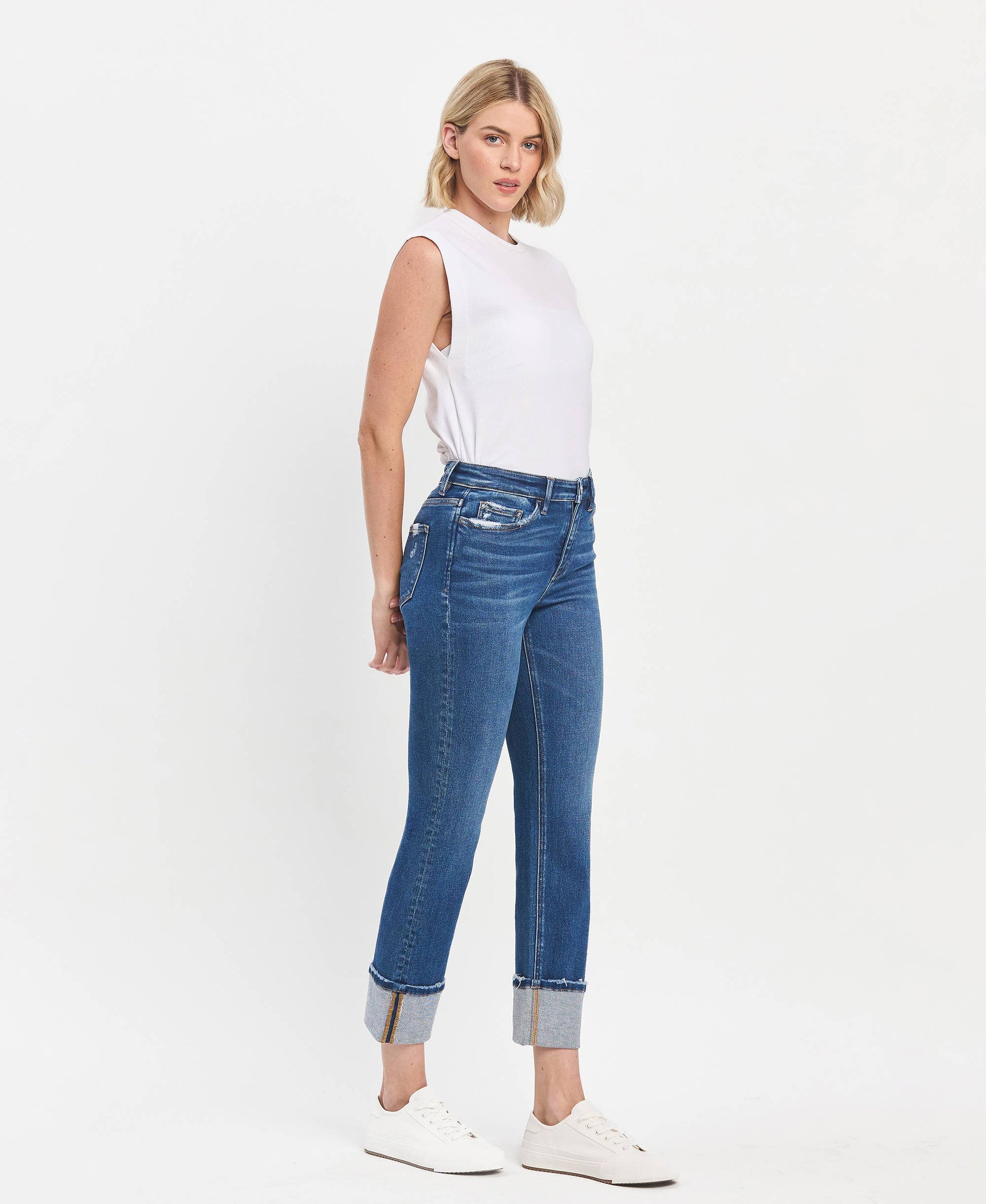 High Rise Cuffed Slim Straight Blue Jeans, available in sizes 24-32. Medium blue wash with cuffed hems.