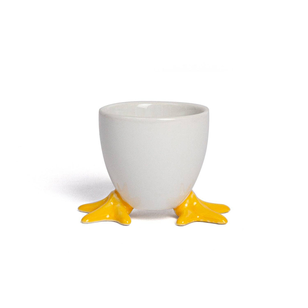 Handmade ceramic egg-shaped cup with yellow duck feet, ideal as a soap holder; available in multiple sizes.