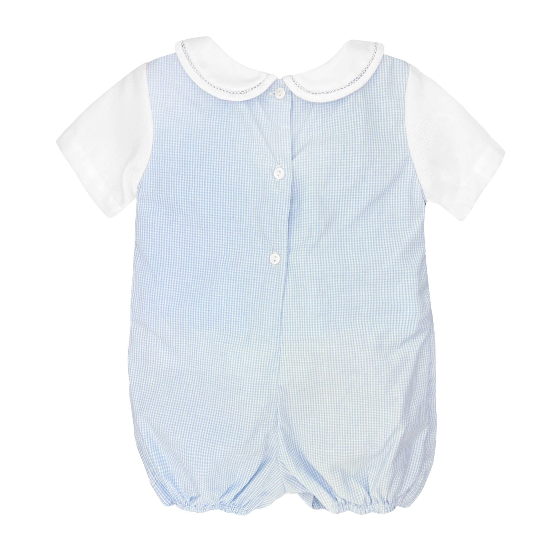 Back of blue romper with white shirt. Romper has button closures on back and elastic pant holes.