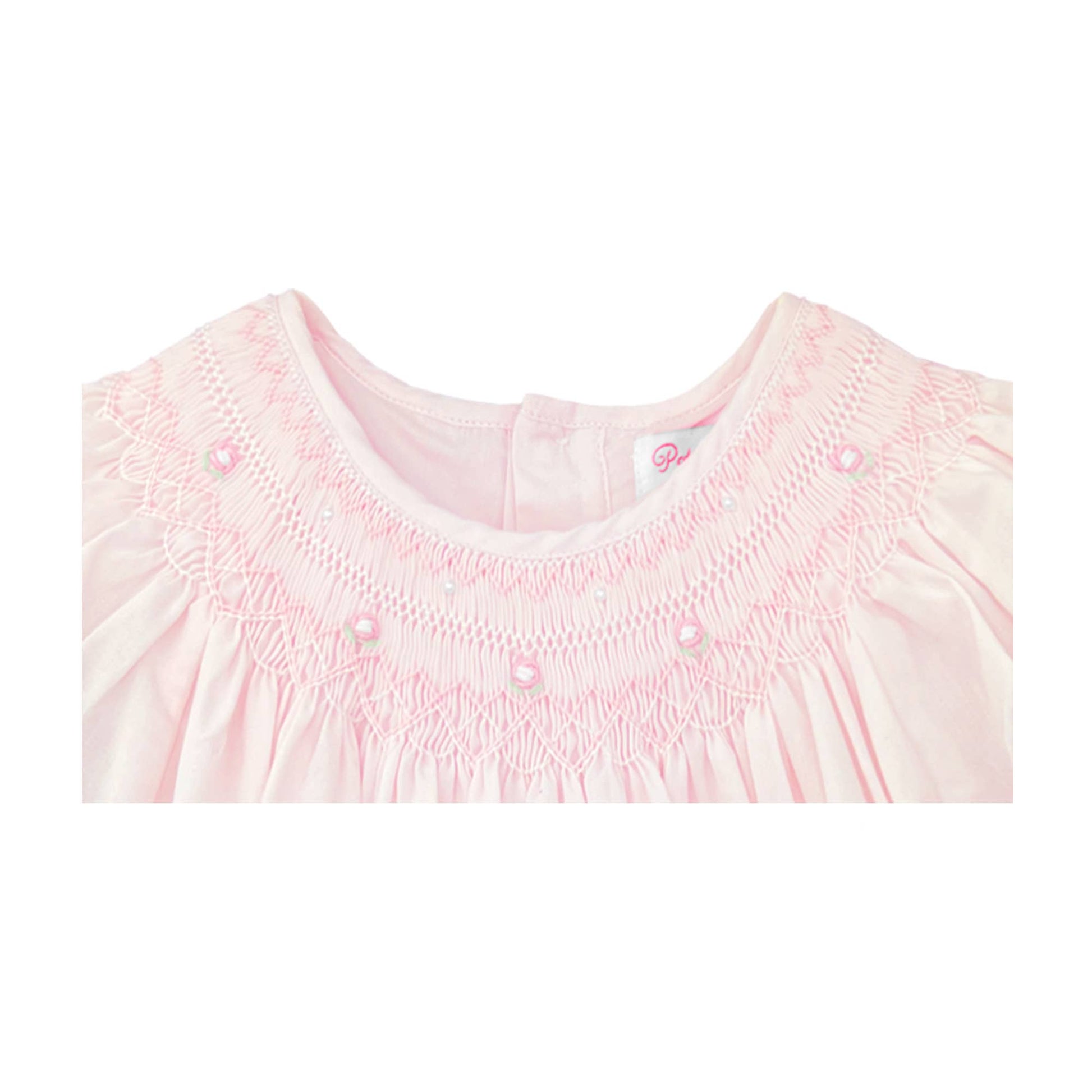 Neckline of Pink daygown with heart smocking and pearls