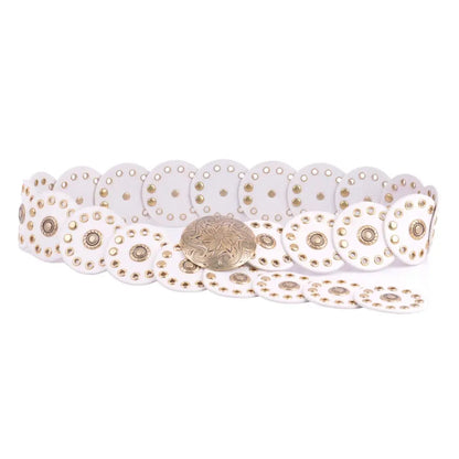 The Western Arrow Circle Belt is a white genuine leather belt with circular metal studs and an ornate metal buckle. Sizes: S, M, L, XL.