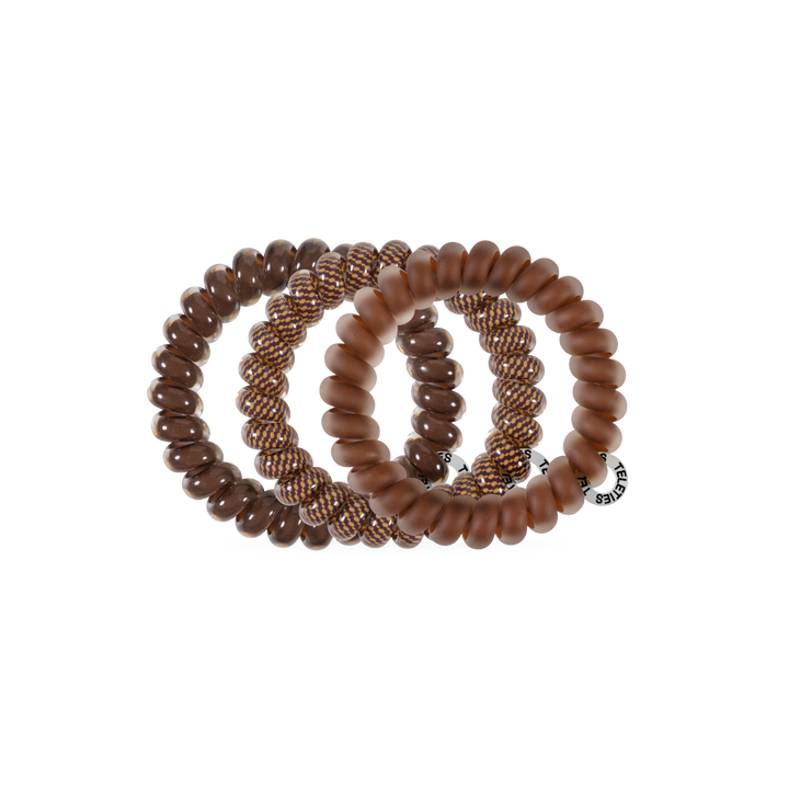 Three Morning Brew Large Hair Ties in textured shades of brown, no-crease design, available in large size; one includes a small round tag.