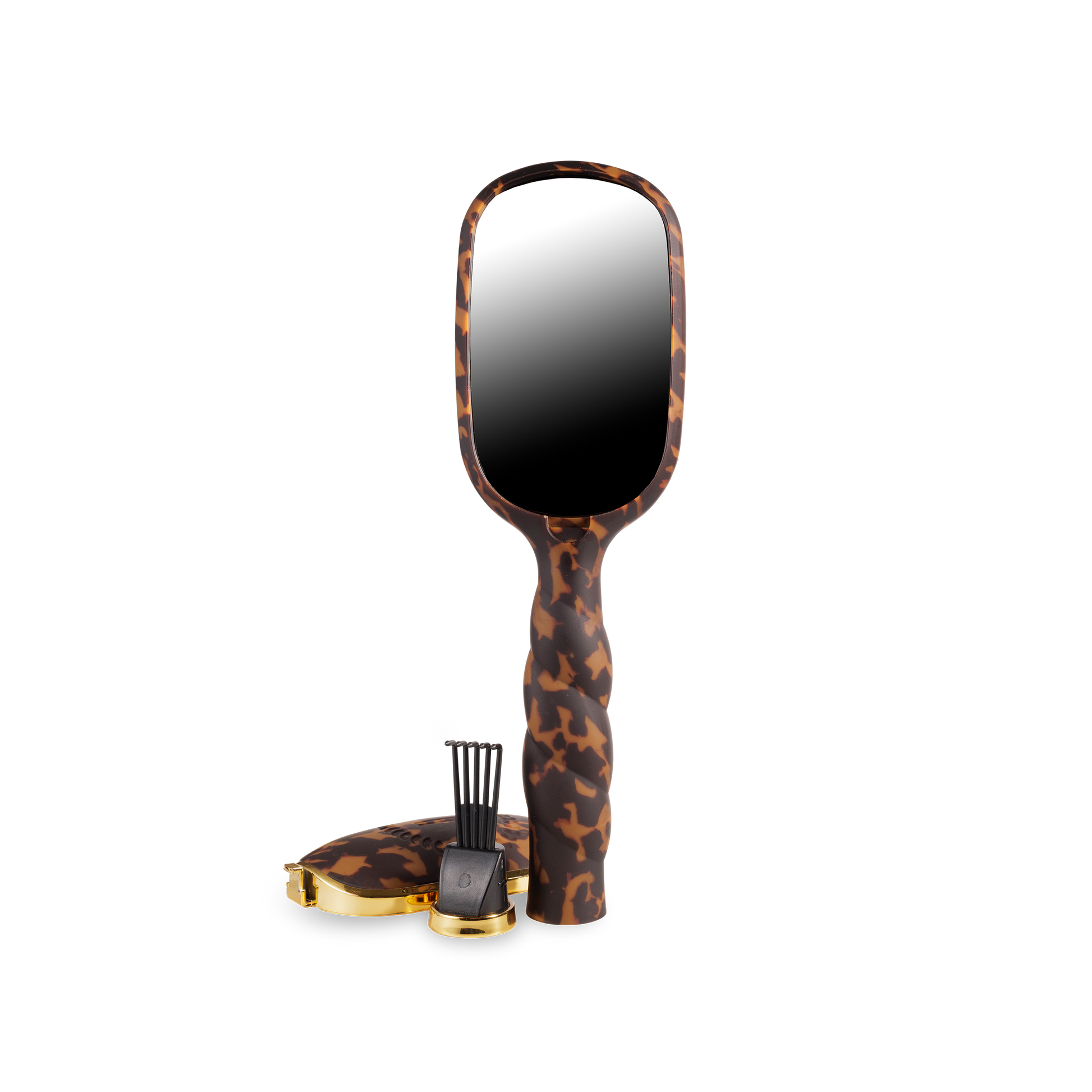 Brown tortoiseshell-patterned folding boar bristle hair brush. Sizes available: small, medium, large.