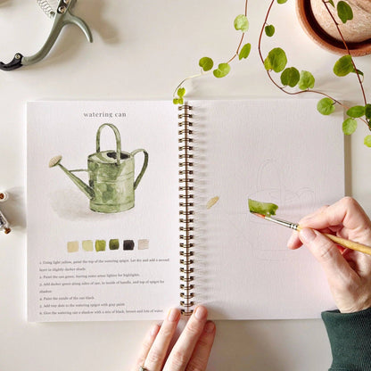 Garden Watercolor Workbook with garden-themed illustrations, paint swatches, and step-by-step instructions. Sizes: standard.