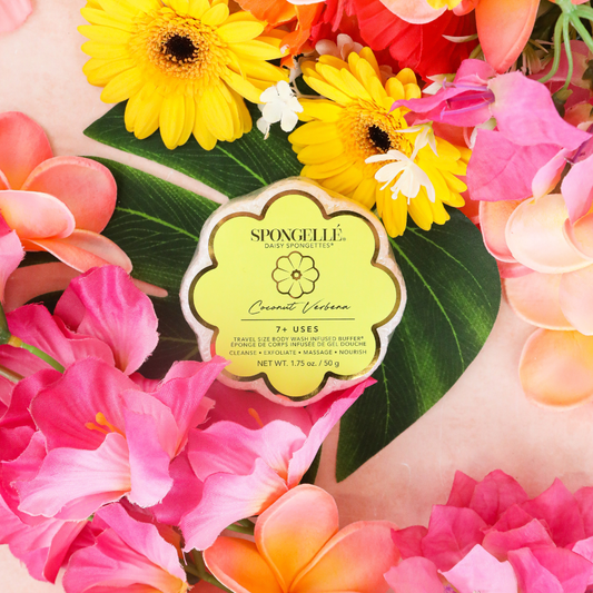 Coconut Verbena Daisy Spongette Soap Buffer in a yellow flower-shaped package; available in multiple sizes.
