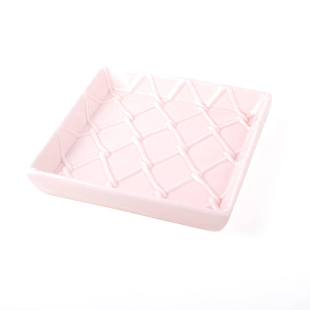 Square light pink ceramic napkin tray with crisscross diamond texture. Available sizes: 6x6 in.