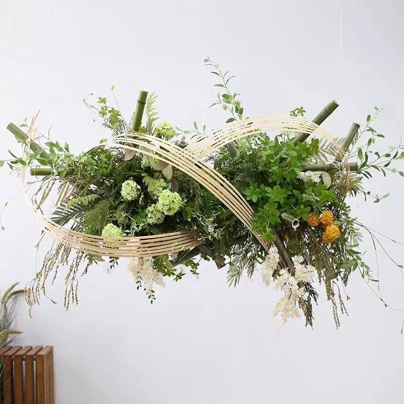 Suspended faux floral arrangement with lush green foliage, 40" Long-5 Blooms-Premium Faux Snowball hydrangea spray (Green), bamboo sticks, and delicate wooden strips. Sizes: 40" long.