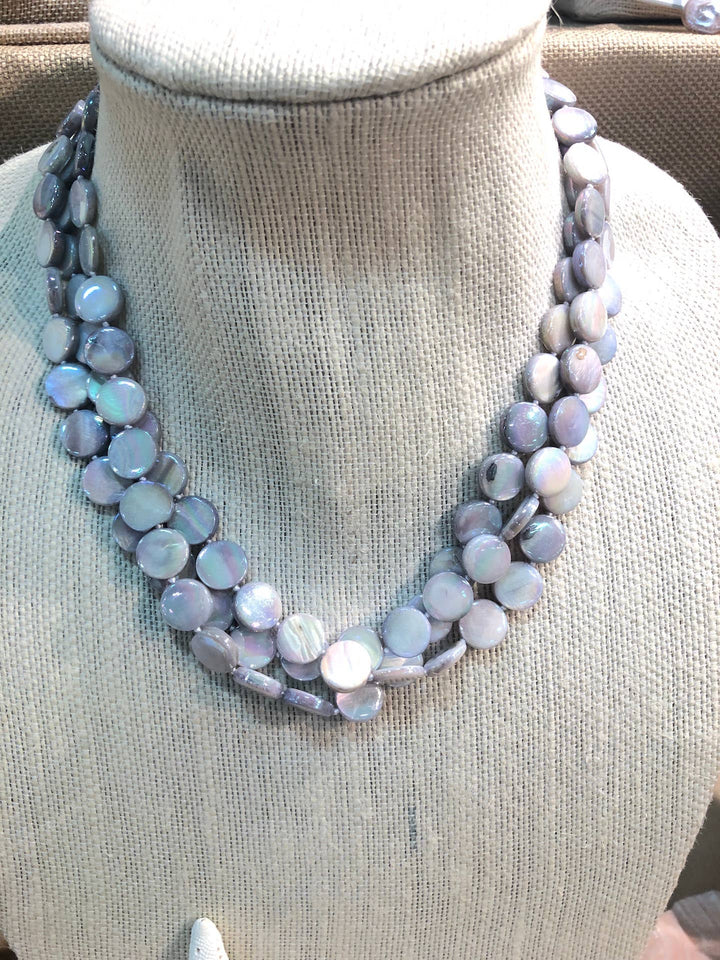 Mother of Pearl 3 Strand Necklace with magnet clasp; iridescent light purple and silver shell disc beads. Sizes: S, M, L.