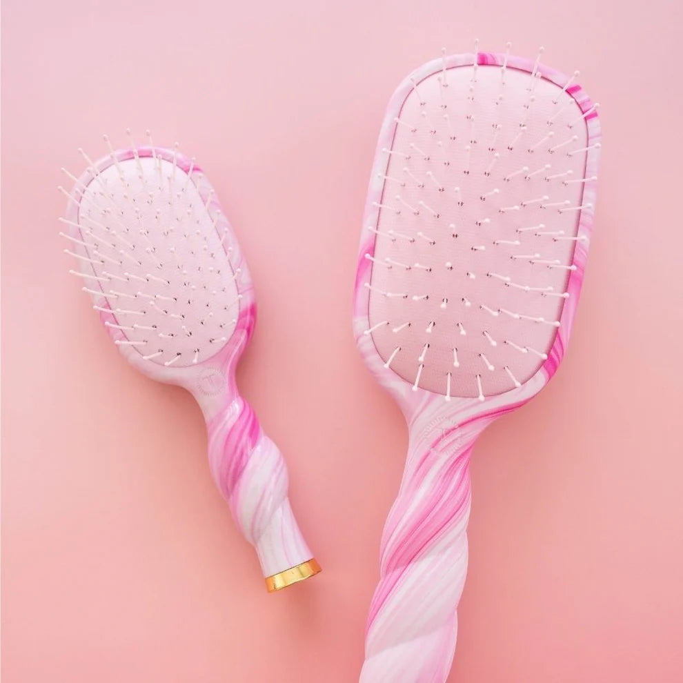 Two Pinch Me! Tie Dye Pink Detangler Hair Brushes, pink and white swirls; available in mini and medium sizes.