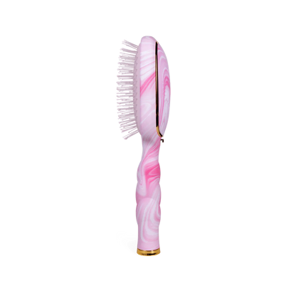 Pink and white marbled detangler brush with gold accents, soft bristles, and curved handle. Available in medium size.