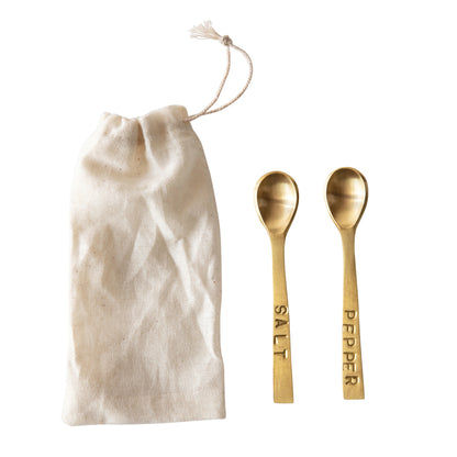 3-1/4"L metal "Salt" and "Pepper" spoons with brass finish; includes cream-colored drawstring bag. Set of 2.
