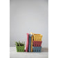 A stack of colorful, empty berry containers available in red, yellow, and green. Sizes: Small and Large.