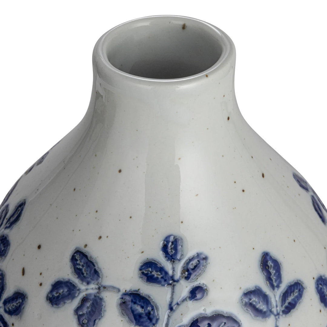 Hand-Painted Stoneware Vase in blue and white with rounded shape, smooth finish, brown speckles, and embossed blue leaf patterns. Sizes: S/M/L.