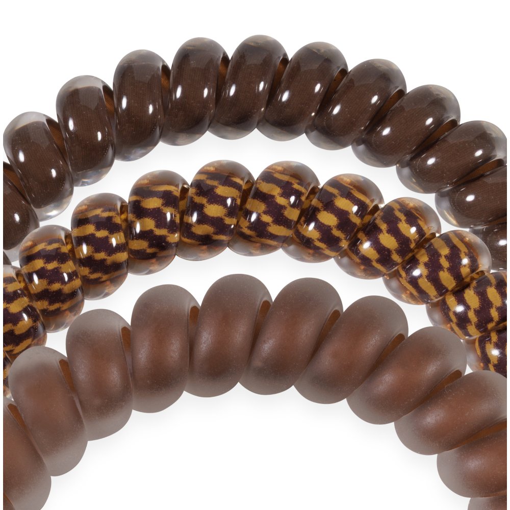 Three Morning Brew Small Hair Ties in dark brown glossy, yellow-brown patterned, and matte brown. Available in small size.