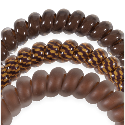 Three Morning Brew Small Hair Ties in dark brown glossy, yellow-brown patterned, and matte brown. Available in small size.