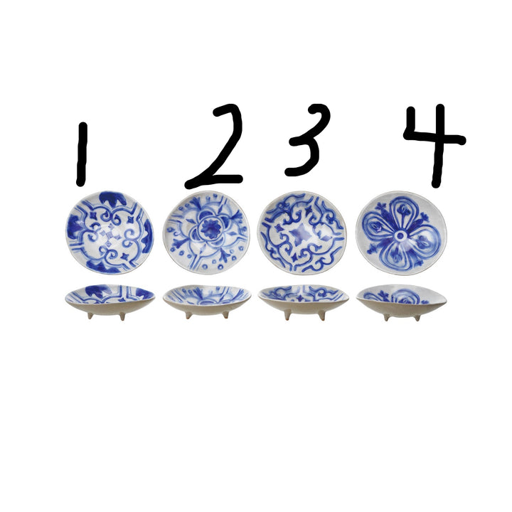 Set of four blue and white hand-painted stoneware footed dishes, each with unique patterns. Sizes available: small, medium.