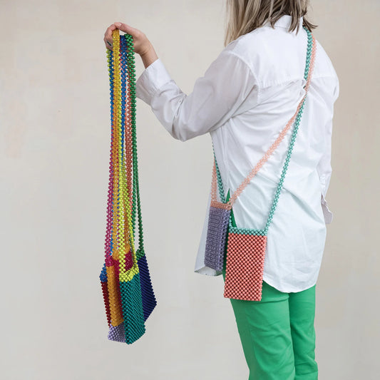 Handmade Acrylic Beaded Two-Tone Crossbody Phone Case. Available in one size that fits most smartphones.