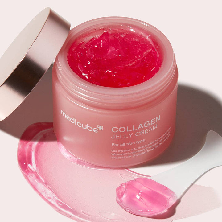MEDICUBE Collagen Niacinamide Jelly Cream jar open, pink gel shown with spatula. Available in 50ml and 100ml sizes.