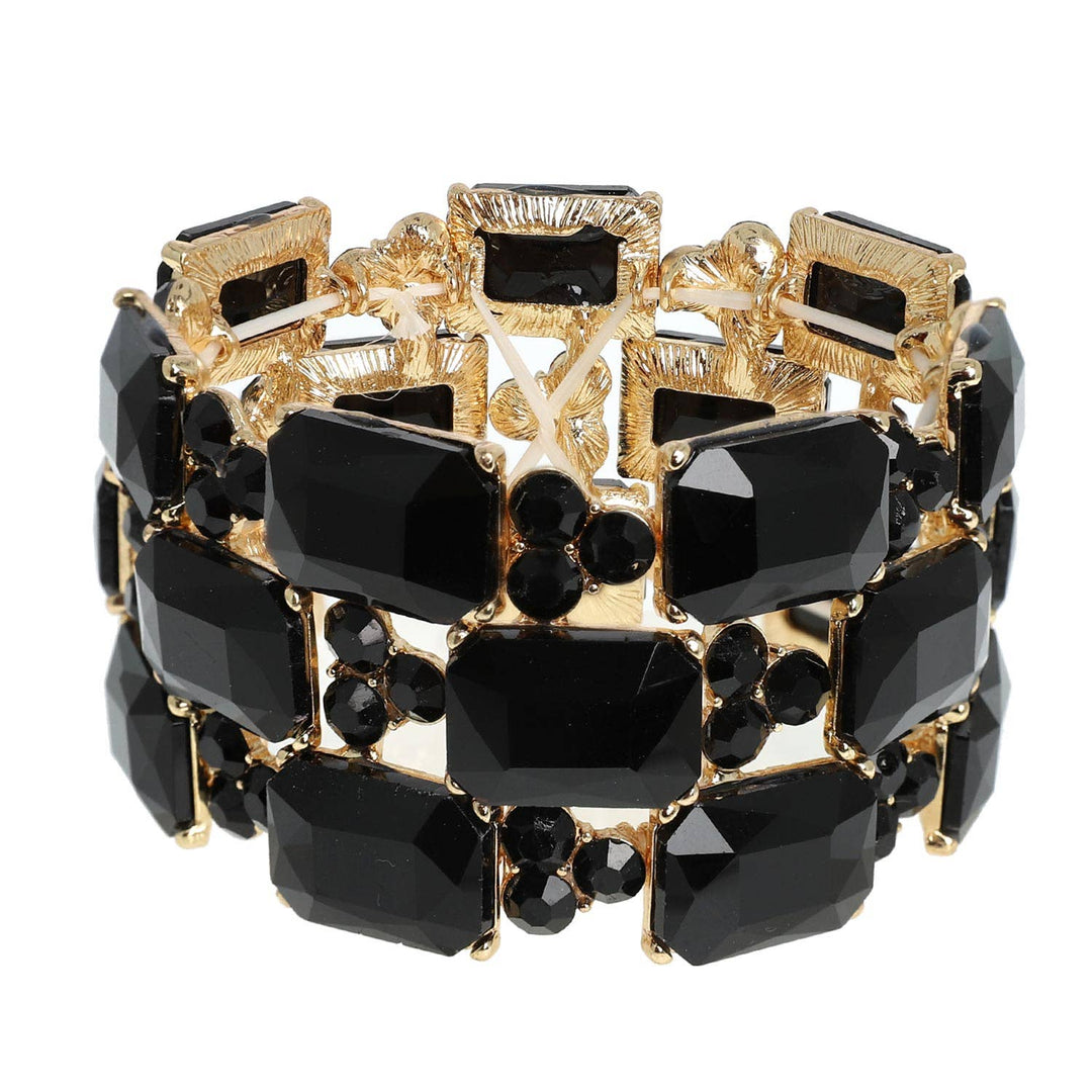 Gold bracelet with three rows of large rectangle and small round black gems. Available in S, M, and L sizes.
