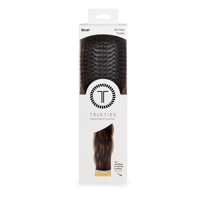 Rectangular white box with clear window displays Boar Bristle Hair Brush | Tortoise. Available in standard and large sizes.