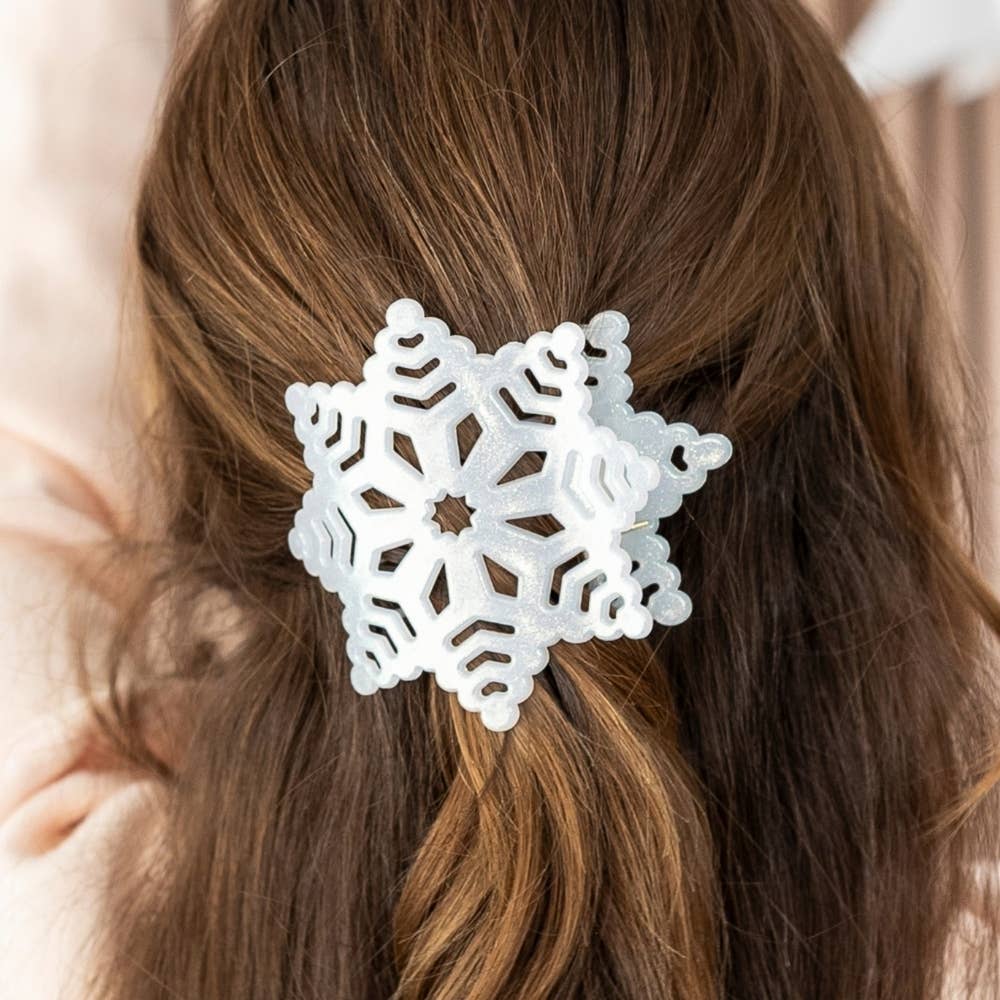 White glittery snowflake flat hair clip.