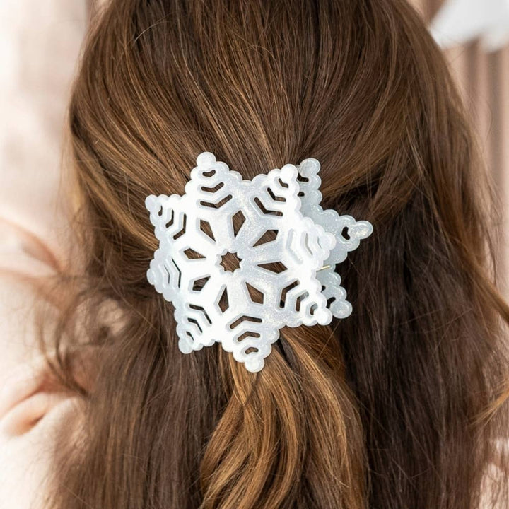White glittery snowflake flat hair clip.