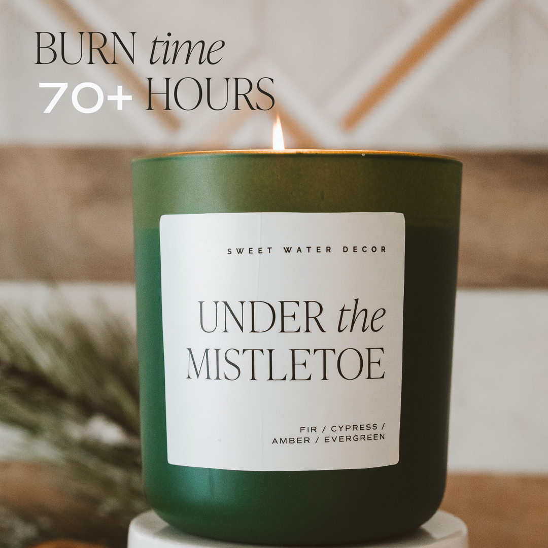 15 oz Under the Mistletoe soy matte candle with lit wick and 70+ hour burn time.