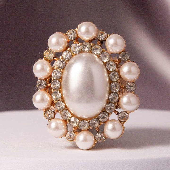 Oval Crystal Sunburst Double Halo Stretch Ring with central oval crystal, clear rhinestones, round pearls. Sizes: stretch fit.