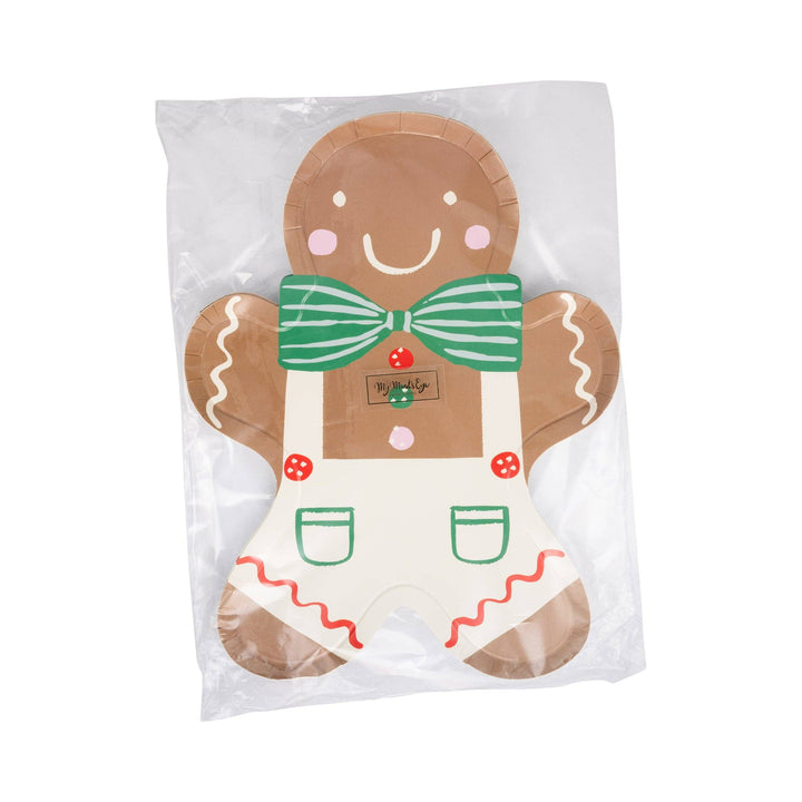 Gingerbread man plate with a green striped bow tie and white overalls.