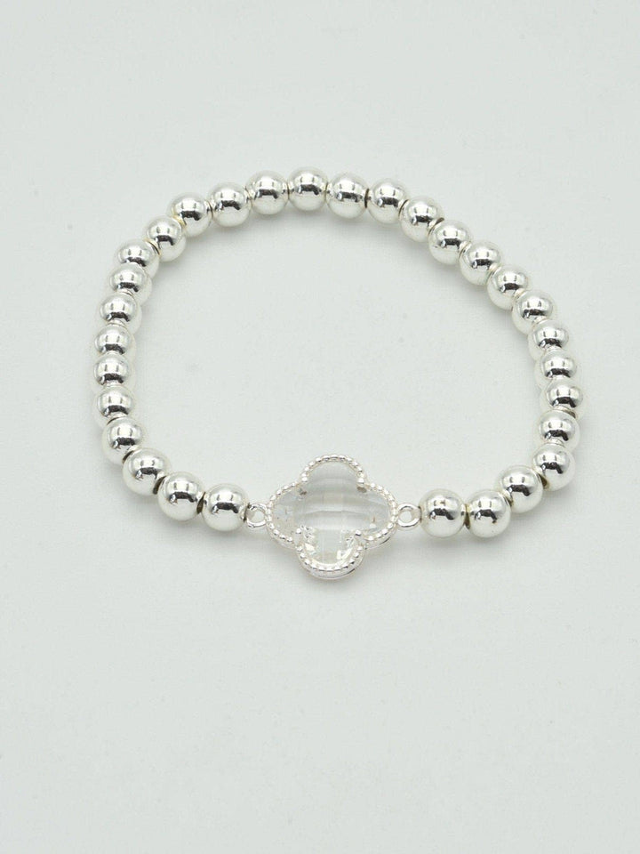 Gold and silver beaded bracelet with a crystal clover charm. Available sizes: S, M, L.