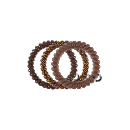Three waterproof Morning Brew Small Hair Ties in brown tones, each with a unique texture—smooth, matte, and braided with gold accents—plus a silver tag. Available in small size. No-crease, gentle on hair.