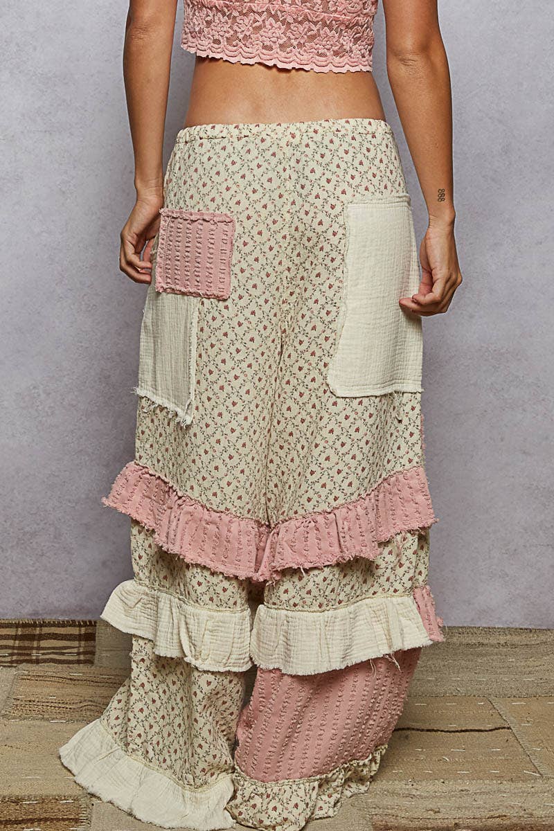 Textured Twill Contrast Ruffle Printed Wide Pants with wide legs, ruffled tiers, cream/pink patch pockets. Sizes XS-XL.