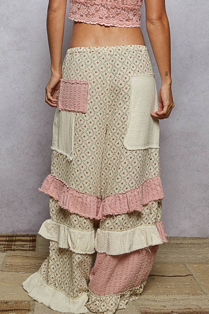 Textured Twill Contrast Ruffle Printed Wide Pants with wide legs, ruffled tiers, cream/pink patch pockets. Sizes XS-XL.