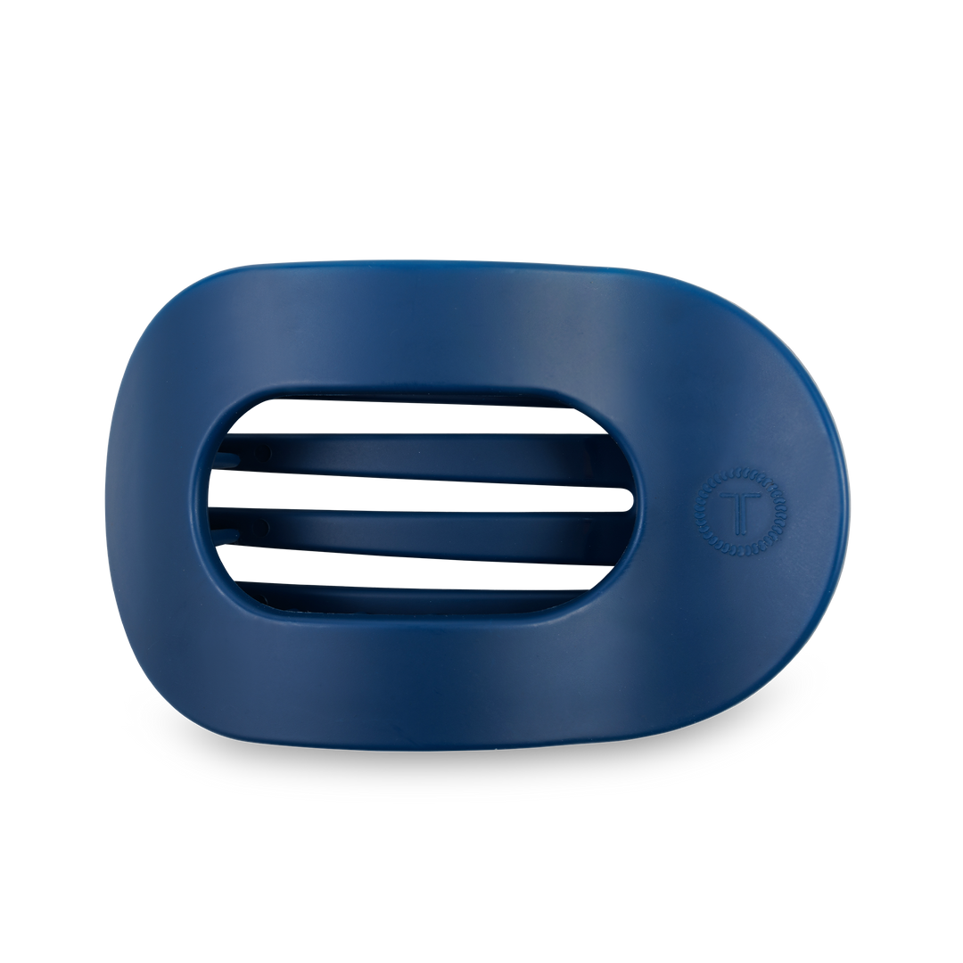 Dark blue, oval soap dish with three drainage slots and a "T" logo on the right. Available in multiple sizes.