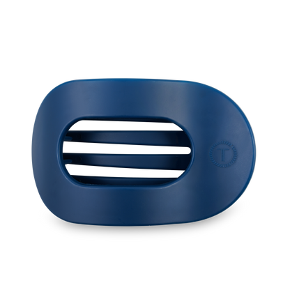 Dark blue, oval soap dish with three drainage slots and a "T" logo on the right. Available in multiple sizes.