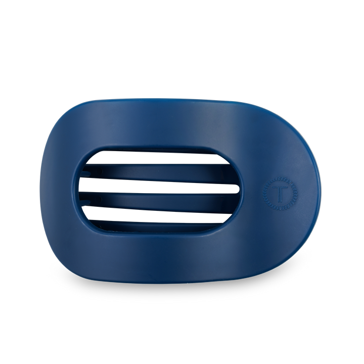 Dark blue, oval soap dish with three drainage slots and a "T" logo on the right. Available in multiple sizes.