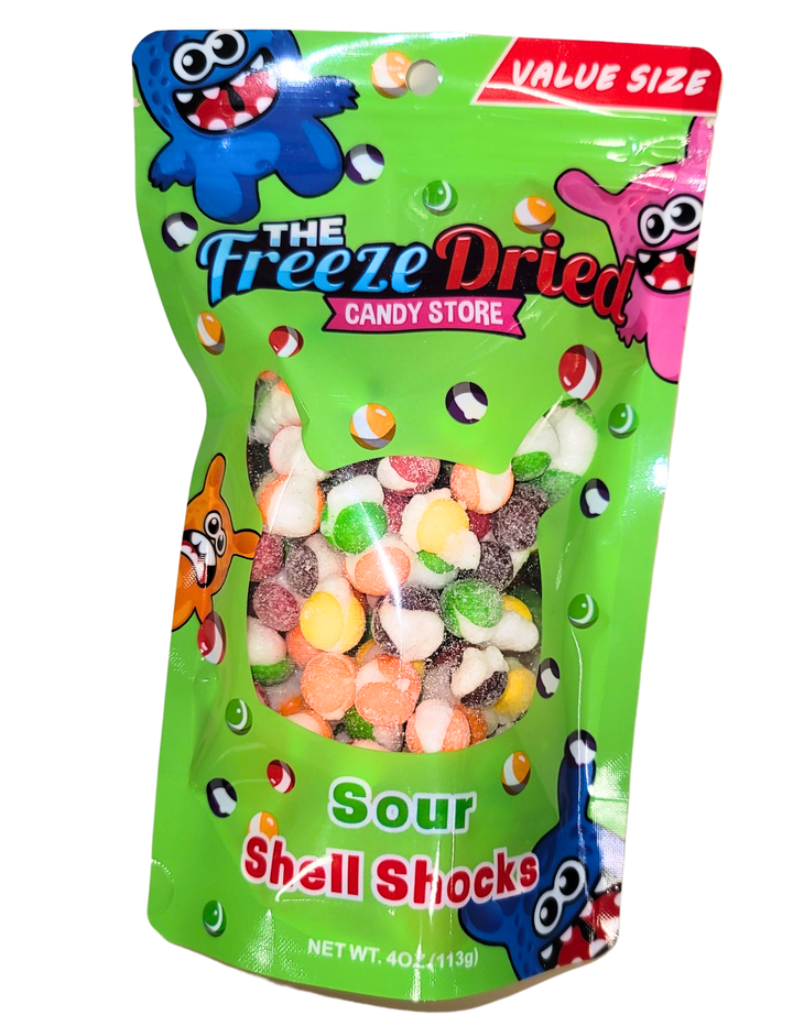 Green bag labeled "Freeze Dried Shell Shocks: Sour Wild Berry," 4 oz, with visible crunchy wild berry candy through a clear window.
