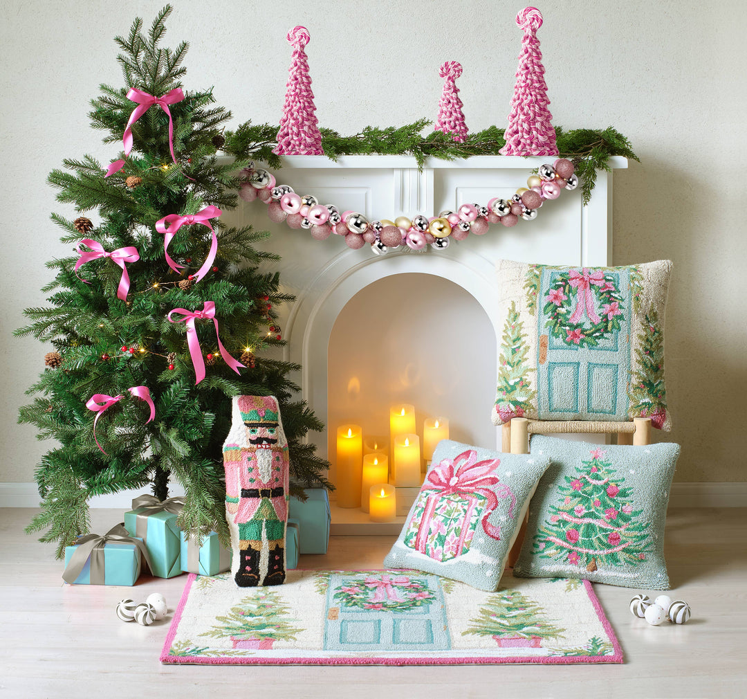 Shaped Pink Nutcracker Hook Pillow in pastel pink; available sizes: 16″x8″.