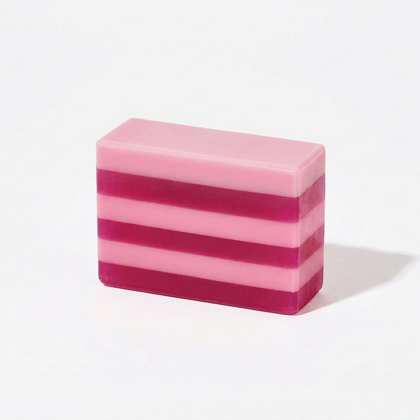 Handmade Candy Cane Bar Soap with red and white layers, red chunks on top, peppermint scent. Available in 4oz and 8oz sizes.
