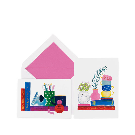 Charmed Library Notecard Set by Kate Spade with book, cup, and plant illustrations. Available in standard notecard size.
