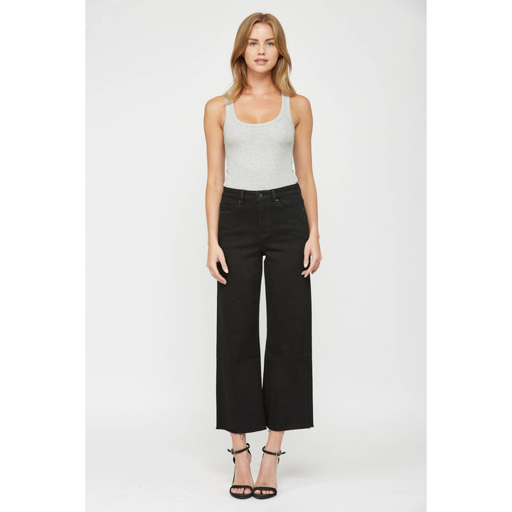 Black wide-leg cropped jeans with raw hem, size 28.