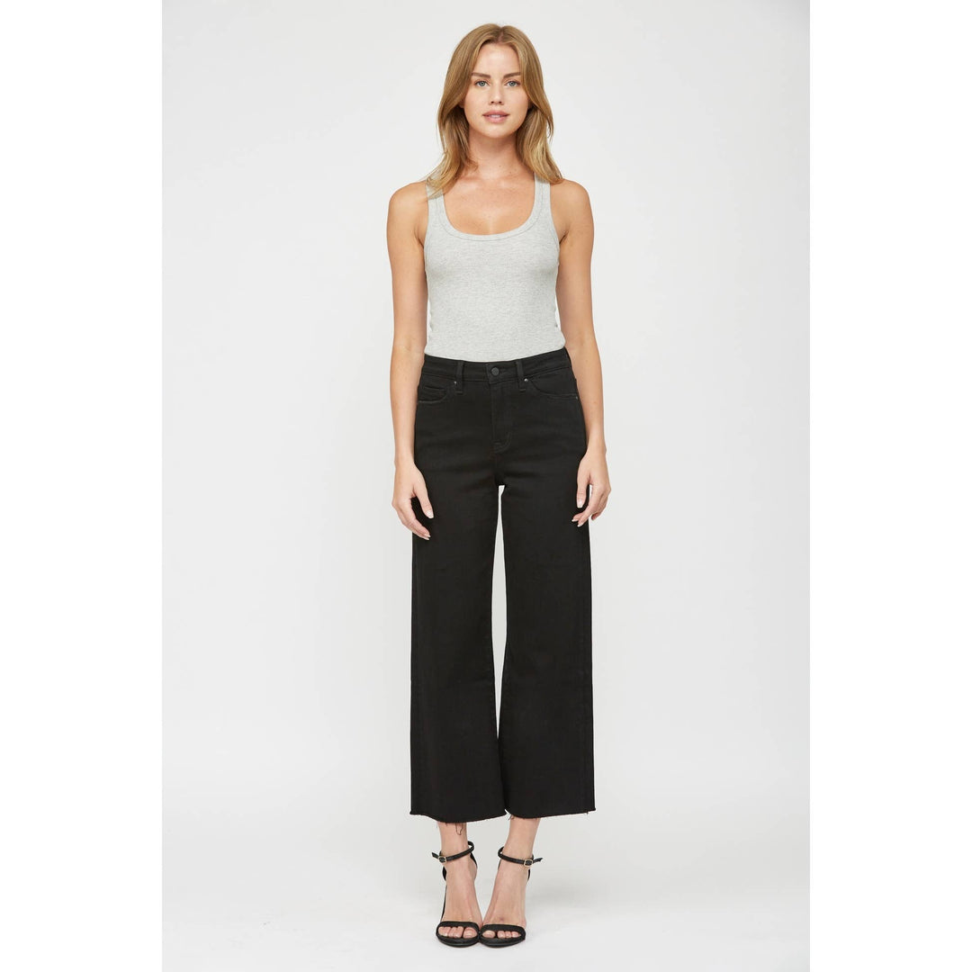 Black wide-leg cropped jeans with a raw hem. Size 24.
