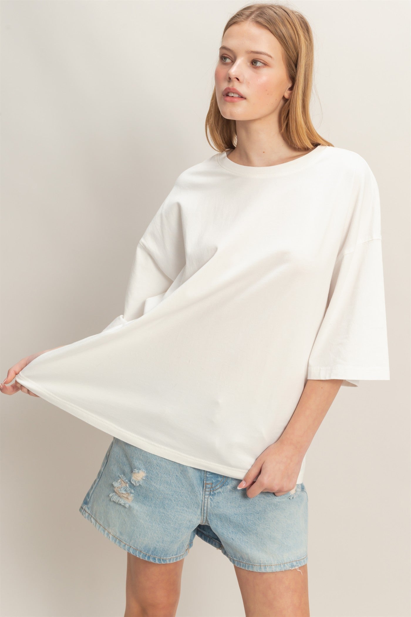 Washed Oversized Crew Neck Top shown; available in sizes XS-XL.