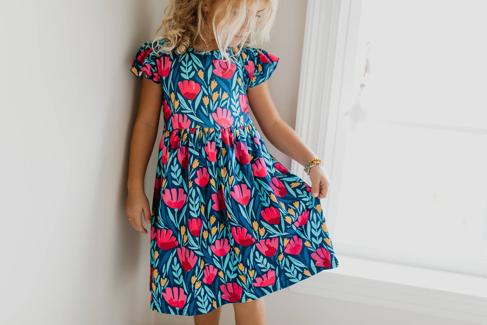 Kids Blue Floral Flutter Sleeve Dress with red and pink flowers, available in sizes 2T-8.
