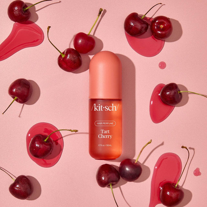 Tart Cherry Hair Perfume bottle with odor-eliminating technology; available in 50ml and 100ml sizes.